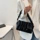 Shoulder bag with ruffled strap and interchangeable chain